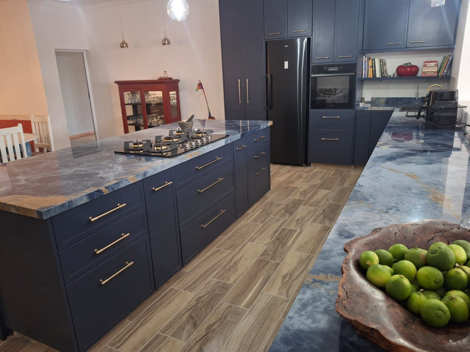 Blue granite kitchen island and countertops installed by Rhino-Stone Marble & Granite in South Africa